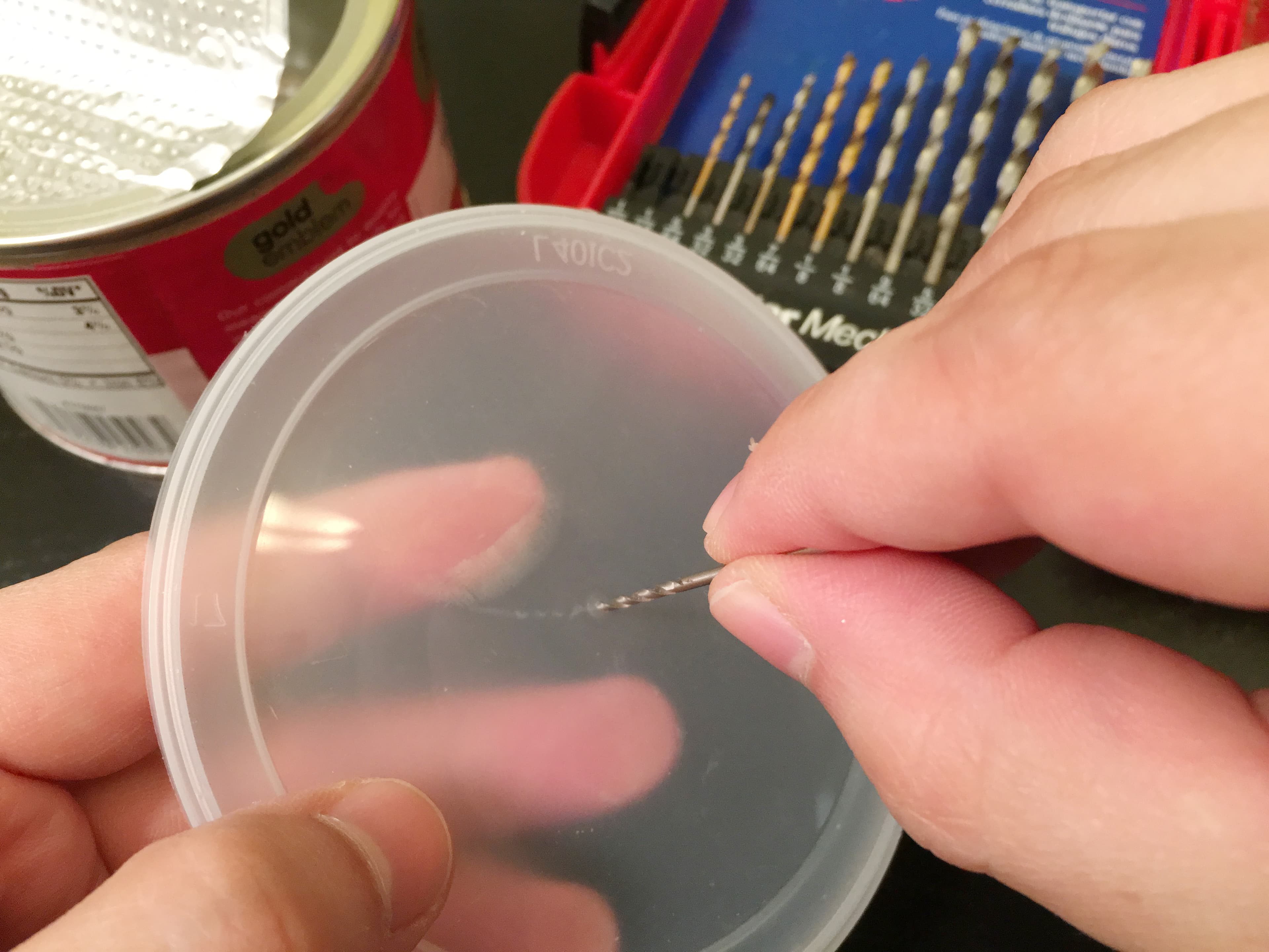 Drilling hole in lid